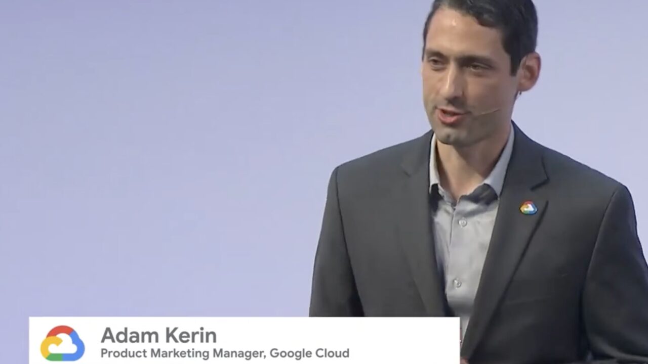 Adam Kerin speaking on stage as Product Marketing Manager, Google Cloud
